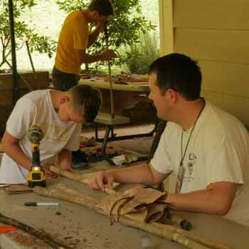 dad and son building wood craft