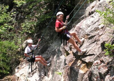two girls rappelling