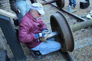 phil raynes working on railcar wheels