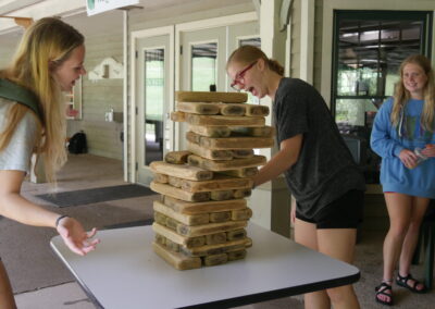 girls playing Giant Jenga
