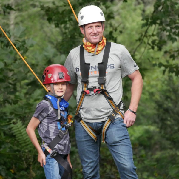 father and son in climbing gear