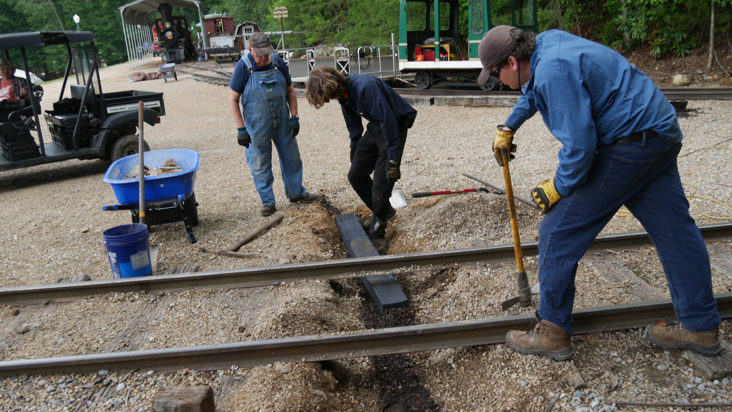 workers replacing railroad tie