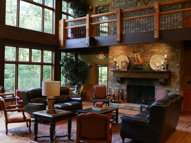 Cedar Mountain Lodge great room seating area with stone fireplace