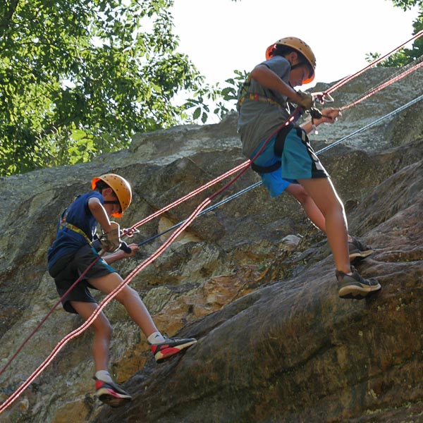 discover ADVENTURE - 2 boys rappelling on a rock face