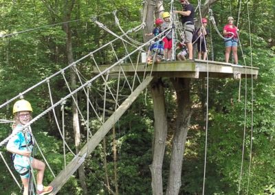 kids on cable bridge and tree deck