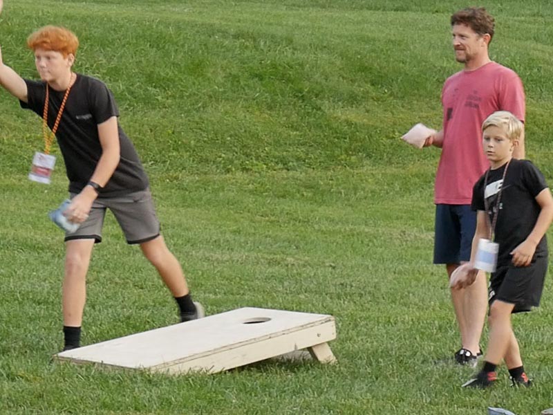 people playing corn hole