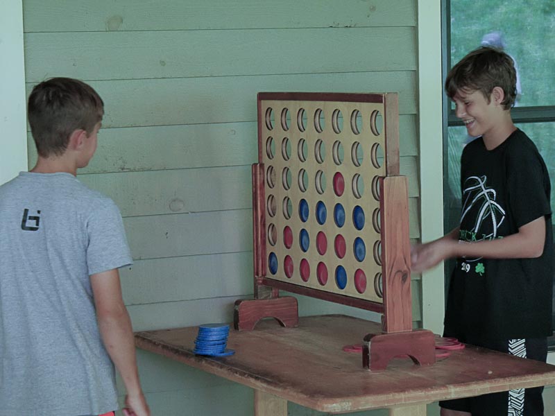 boys playing giant connect 4