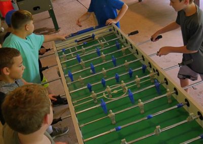 kids playing foosball