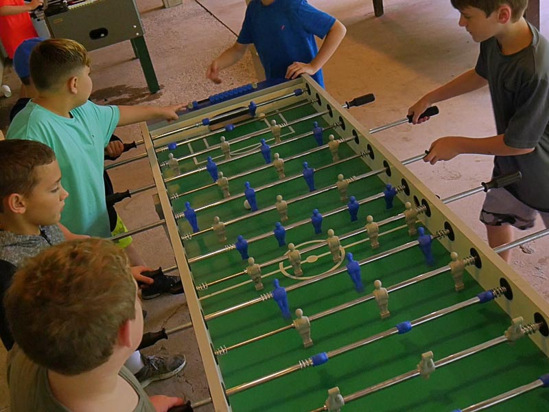 kids playing foosball