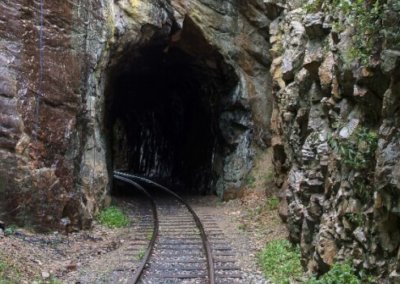 railroad tracks in mountain tunnel