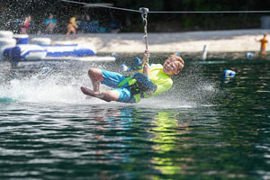 zipline boy on water zipline landing in lake